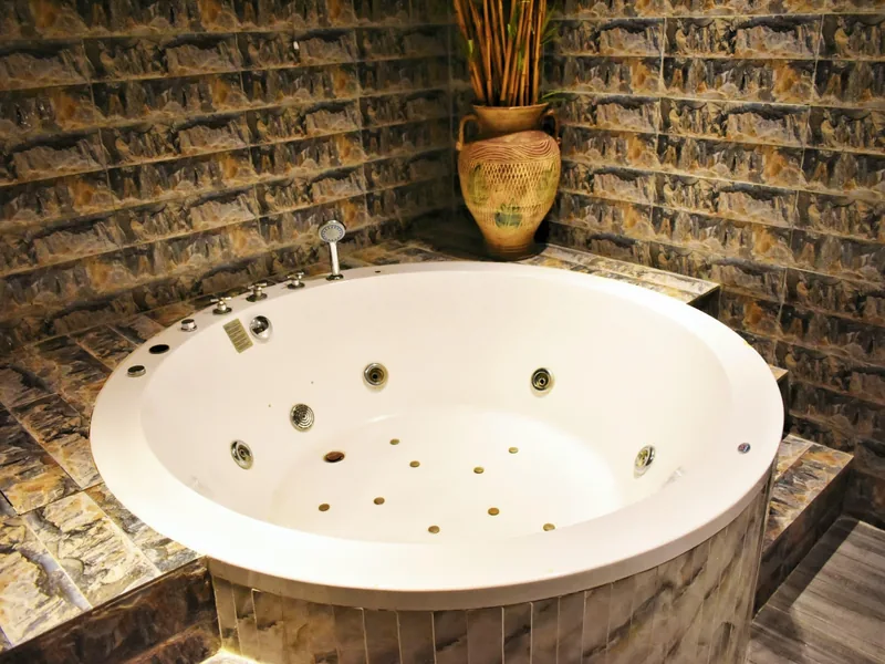 Jacuzzi room with stone walls at Facial Bar, Victoria Island, Lagos